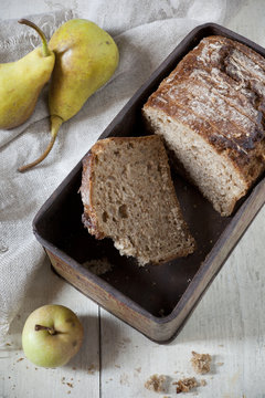 wholemeal sliced bread on vintage box with fruits