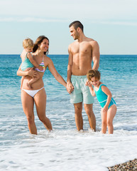 Family of four at the beach