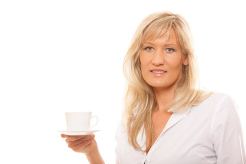Mature woman drinking tea or coffee..