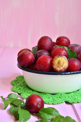 Plum in a white bowl.