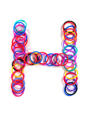Colorful rubber band character "H".