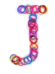 Colorful rubber band character "J".