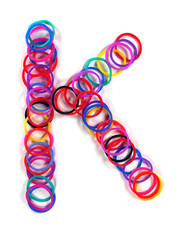 Colorful rubber band character "K".
