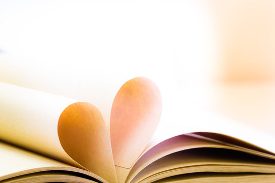 Pages Of Open Book Rolled In Heart Shape