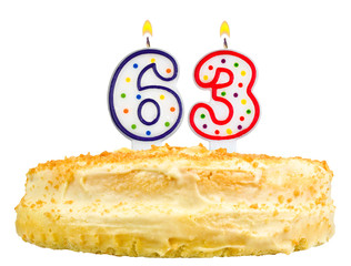 birthday cake with candles number sixty three isolated on white