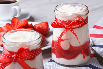 Strawberry yogurt in a jar closeup horizontal