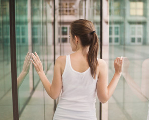 Toned picture of a young girl viewed from the back standing betw