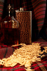 The still life with the scotland whiskey bottle and flask