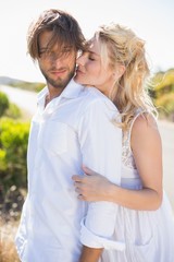 Obraz premium Attractive couple embracing by the road