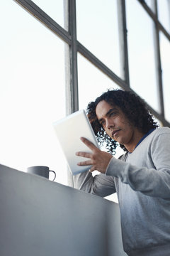 Checking His Emails With His Morning Coffee