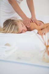 Obraz na płótnie Canvas Pretty blonde enjoying a massage