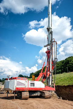 Industrial rig on construction site, drilling holes