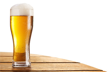 Cold beer glass on the bar table. Clipping paths.