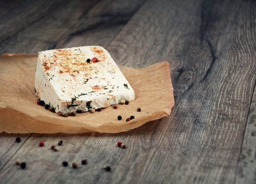 Tasty old peace of cheese on the table