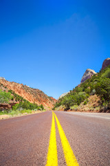 Straight road through mountainous area