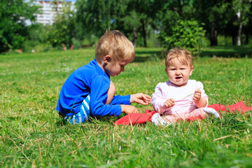 Naklejka na ściany i meble kids playing in summer park