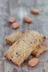Close - up almond cookies on wood background