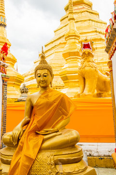 Ancient pagoda with buddha statue of Phra Borom Thad Bantak temp