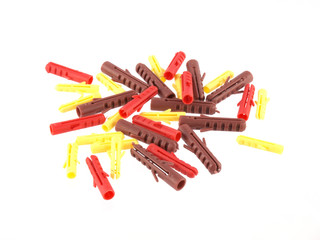 Close up of assorted raw plugs on a white background.