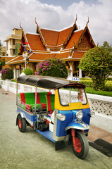 Tuk Tuk taxi in front of a temple