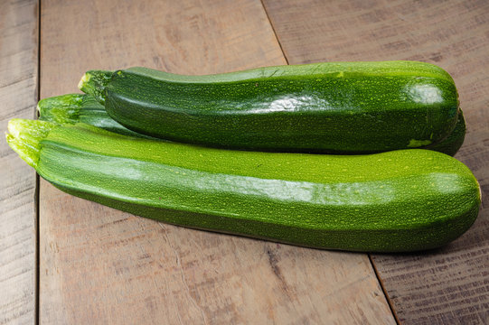 Zucchini squash on wooden table