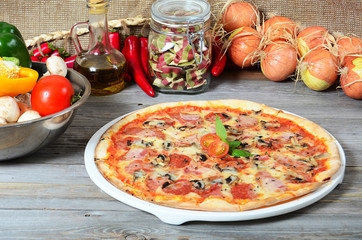 The Italian pizza with olives and a salami