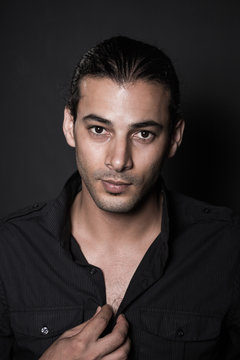 Portrait of young elegant man in the black shirt