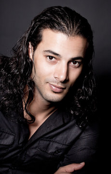 Portrait of young elegant man in the black shirt