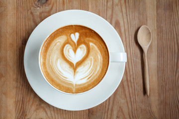 Top view cup of coffee latte with spoon