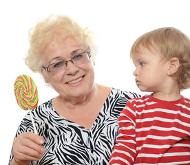 The elderly woman with little grandson