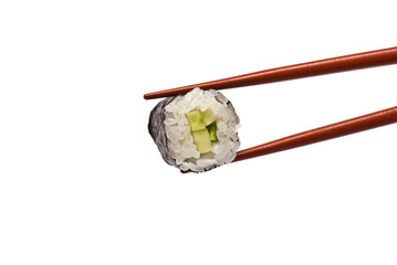 Sushi Roll is held by Chopsticks isolated on white