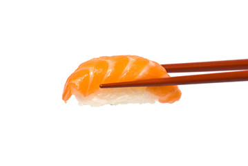 Sushi with Salmon is held by Chopsticks isolated on white