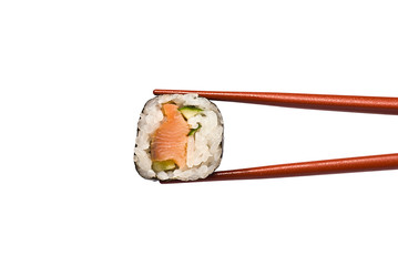 Sushi Roll is held by Chopsticks isolated on white