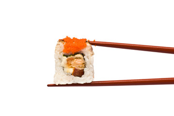 Sushi Roll is held by Chopsticks isolated on white