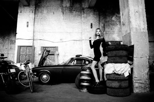 Fashionable Woman In Retro Garage