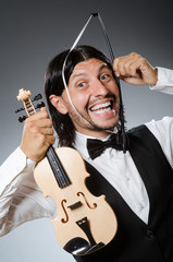 Fototapeta premium Funny fiddle violin player in musical concept