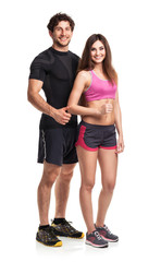 Athletic man and woman with thumb up on the white