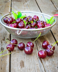 Fresh cherry on wooden table