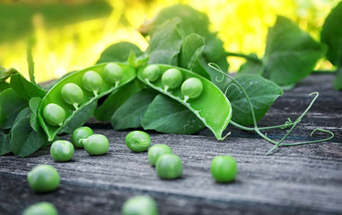 Peas on wooden board
