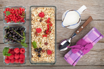 Healty breakfast with muesli, berries and milk
