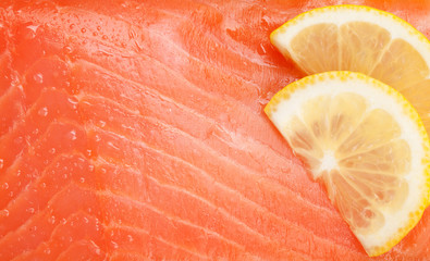 Fresh salmon fish with lemon slices