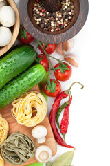 Fresh ingredients for cooking: pasta, tomato, cucumber, mushroom