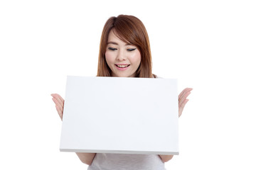 Fototapeta premium Asian girl look at blank sign in front of her