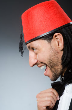 Man in traditional turkish hat and dress