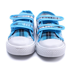 Blue sneakers for a baby on white background - obrazy, fototapety, plakaty
