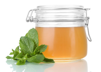 Homemade mint jelly in glass jar, isolated on white