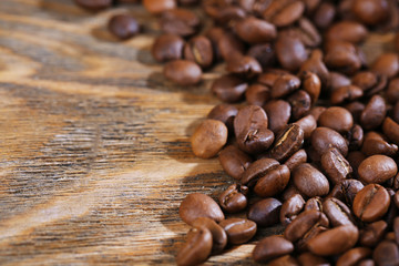 Coffee beans on rustic wooden background