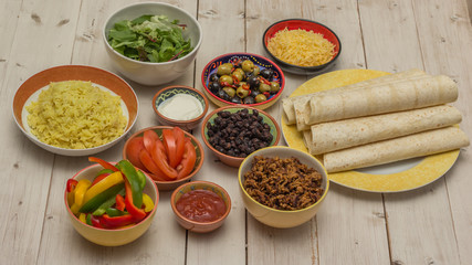 Variety of ingredients to make mexican burritos