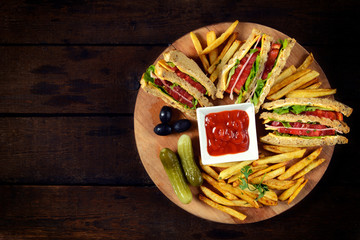 Club sandwiches on the wooden table