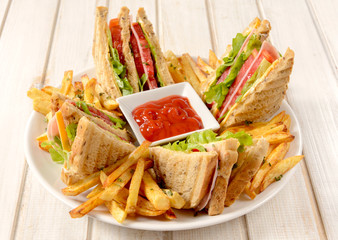 Club sandwiches and french fries